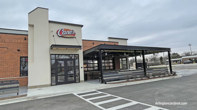 Front entrance with outdoor dining area at Raising Cane's, 225 East Palatine Road in Arlington Heights