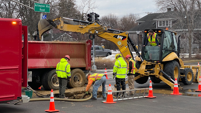 Water main repair work at Arlington Heights Road and Sigwalt Street in the middle of the intersection