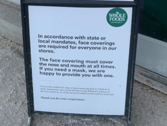 Mask sign in compliance with state mandate at Whole Foods in Schaumburg on Tuesday, January 4, 2022