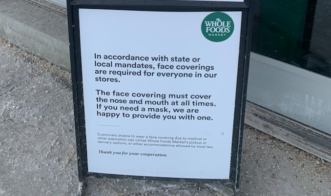 Mask sign in compliance with state mandate at Whole Foods in Schaumburg on Tuesday, January 4, 2022