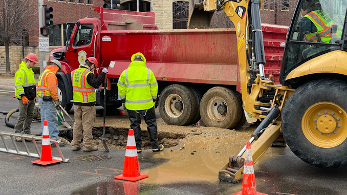 Water main repair work at Arlington Heights Road and Sigwalt Street in the middle of the intersection