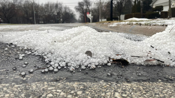 Hail pile near catch basin on Douglas Avenue south of Hintz Road