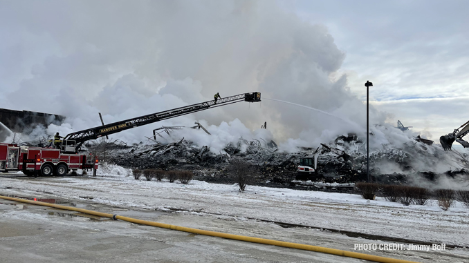 Hanover Park Tower Ladder working at the scene of the Access warehouse ruins which continue to burn as progress is made (PHOTO CREDIT: Jimmy Bolf).