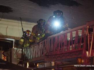 Firefighters on a main aerial at a house fire on Memory Lane in Lake Zurich (PHOTO CREDIT: Jimmy Bolf)