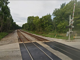 A stolen Toyota sedan driven by armed robbers in an authorized area was struck by a southbound freight train north of this grade crossing at Route 173 (Rosecrans Road) and dragged to the crossing at Route 173 (Image Capture September 2019 ©2022 Google / Street View)