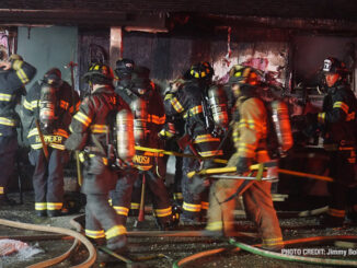 Firefighters at the front of a home destroyed by fire on 3rd Avenue in Cary, Illinois (PHOTO CREDIT: Jimmy Bolf)