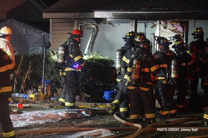 Smoke remains charged in a single-story home after a fire was extinguished on 3rd Avenue north of Klasen Road in Cary