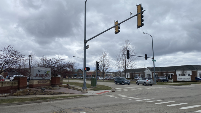 Graffiti at Mariano's sign at the southwest corner of Kensington Road and Dryden Place