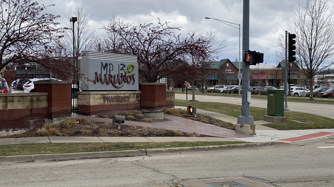 Graffiti at Mariano's sign at the southwest corner of Kensington Road and Dryden Place