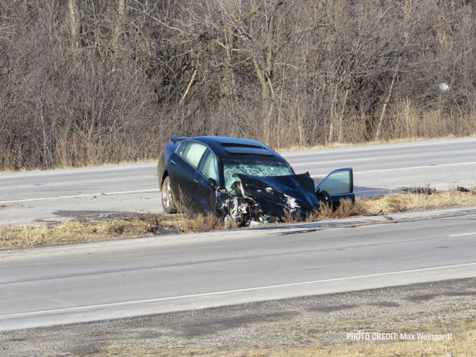 Rollover crash with fire at Route 120 and River Road in Waukegan (PHOTO CREDIT: Max Weingardt)