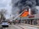 Fire erupts from the roof of Jojo Discount Store on Lawrence Avenue in Chicago (PHOTO CREDIT: Max Weingardt)