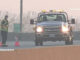 Firefighter and tow truck driver on the Route 53 overpass over Palatine Road Sunday morning April 3, 2022