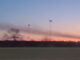 A smoke header from three adjacent detached garage fires in Des Plaines about 2.5 miles north of O'Hare International Airport