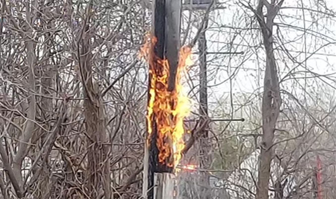 Utility pole fire on the north side of Robert Parker Coffin Road (PHOTO CREDIT: Scott Wallach)