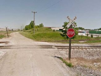 View northbound on Hainesville Road at the Milwaukee District North Metra crossing showing the existing control devices on Monday, May 23, 2022 (Image capture June 2012 ©2022 Google)