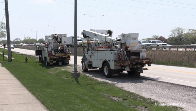 ComEd crews working on the Wilke Road frontage road on the east side of Route 53.