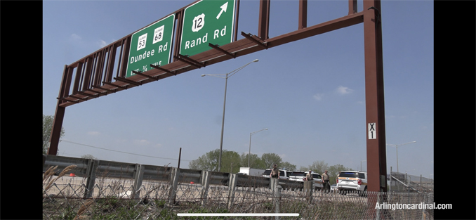 Overhead signs over the northbound lanes near the location of the crashed dump truck.