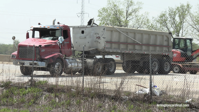 A dump truck uprighted after the  extended dump bed from the truck got snagged in power lines crossing Route 53 on Thursday, May 12, 2022
