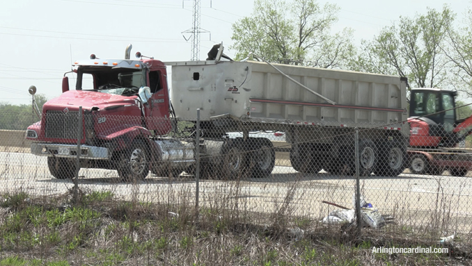 A dump truck uprighted after the extended dump bed from the truck got snagged in power lines crossing Route 53 on Thursday, May 12, 2022