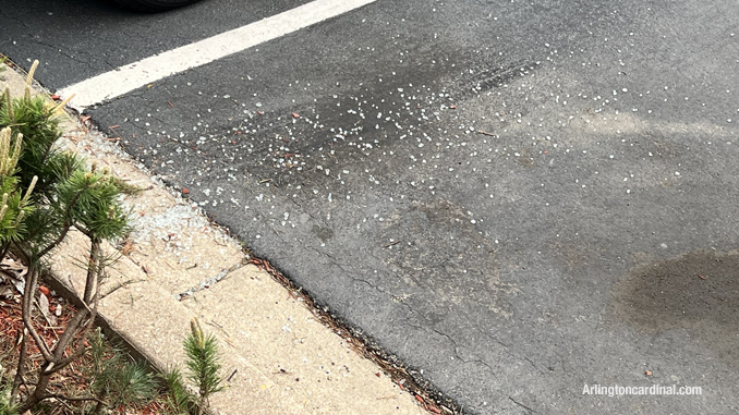 Stolen vehicle patch out with broken glass at the parking lot of Arlington Nissan