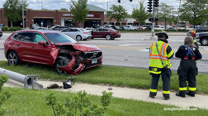 Red Volvo XC60 with front-end damage after the driver struck a light pole at Arlington Heights Road and Rand Road in Arlington Heights