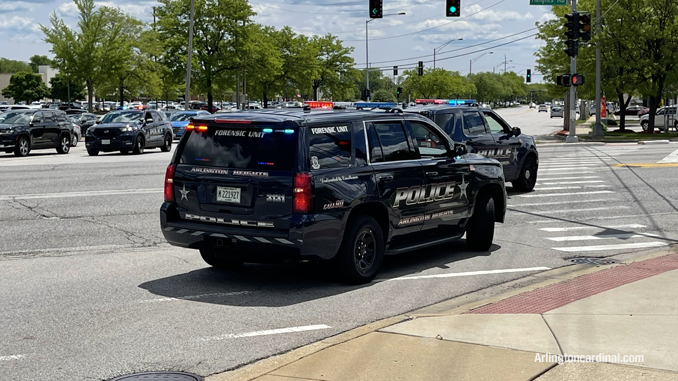 Three police SUVs blocking access to southbound Arlington Heights Road south of Rand Road