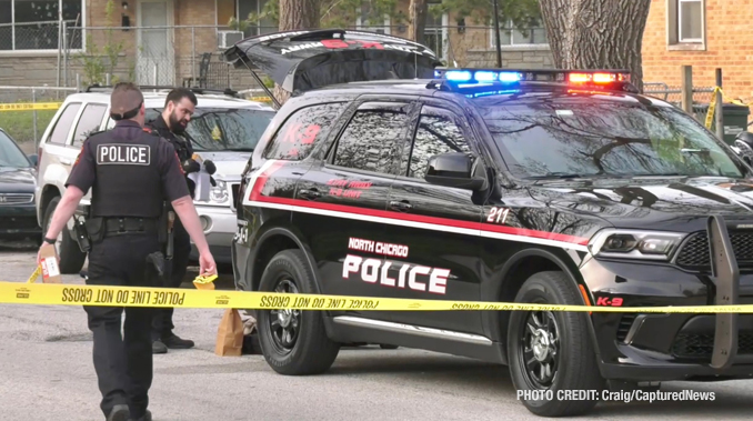 North Chicago Police Department investigating the scene  where two gunshot victims were located near Hervey Avenue and 15th Street in North Chicago (PHOTO CREDIT: Craig/CapturedNews)