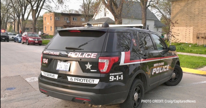 North Chicago Police Department investigating the scene  where two gunshot victims were located near Hervey Avenue and 15th Street in North Chicago (PHOTO CREDIT: Craig/CapturedNews)