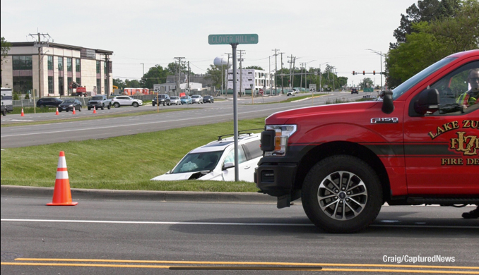 Crash scene at Rand Road and Clover Hill Lane in Lake Zurich (PHOTO CREDIT: Craig/Captured New)