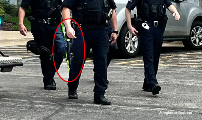 Less-Lethal weapon with yellow tip at the scene at the Fountains of Arlington Condominiums on Rand Road in Arlington Heights