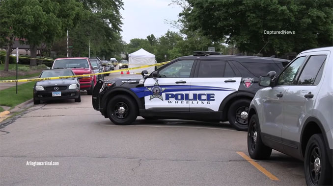 Wheeling Police Department tent covering the bodies of two US Navy personnel found dead in the middle of Lakeview Drive in Wheeling, Illinois.