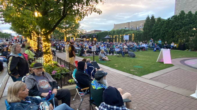 Big crowd watching The Chicago Experience on stage at Harmony Park in Arlington Heights on Friday, July 15, The Chicago Experience on stage at Harmony Park in Arlington Heights on Friday, July 15, 2022