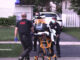 Paramedics moving a patient to the ambulance from a shooting scene on Fletcher Drive west of Elmhurst Road on Saturday, July 30, 2022