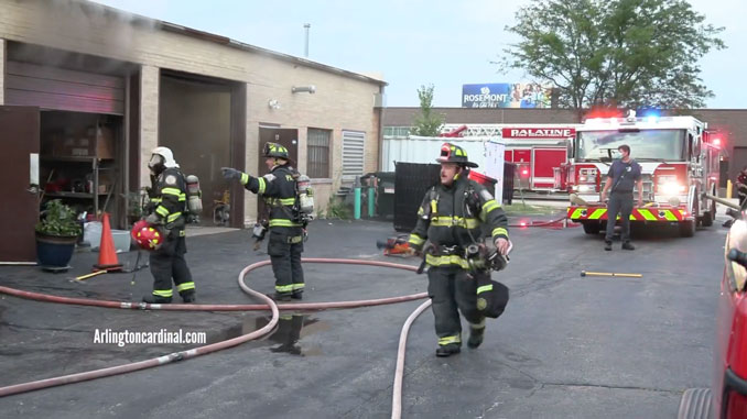 Firefighters on the C-Side (rear of the building) at the corner of Rohlwing Road and Edison Place in Rolling Meadows