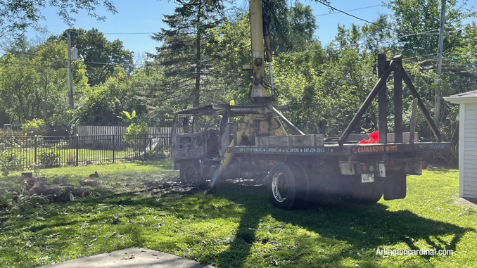 Tree trimming bucket truck destroyed after a fire involving the cab.