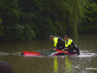 Red pickup truck submerged in a small pond after the driver was rescued in Vernon Hills (PHOTO CREDIT: Max Weingardt)