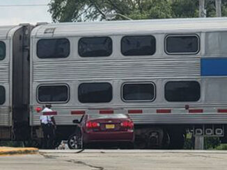 Red sedan in a minor crash with a Metra train at Quentin Road and Colfax Street in Palatine.