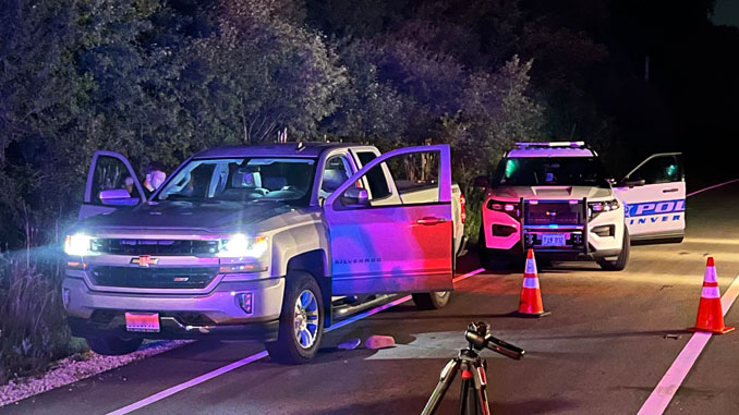 An Inverness Police Department SUV behind a Chevrolet Silverado at Palatine Road and Ela Road during a death investigation by MCAT