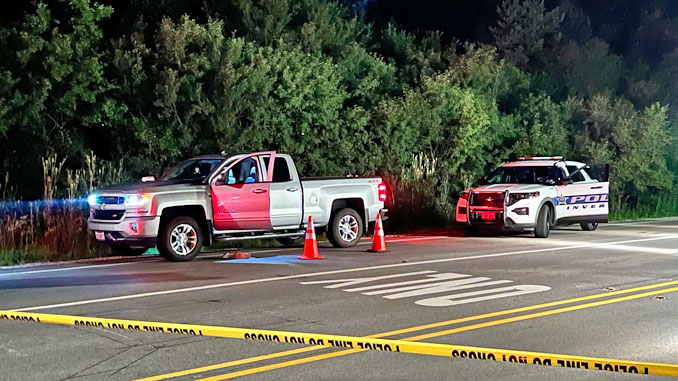 An Inverness Police Department SUV behind a Chevrolet Silverado at Palatine Road and Ela Road during a death investigation by MCAT