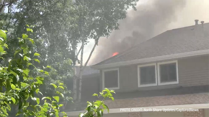 Firefighters work to extinguish fire that was showing at the rear balconies of a townhouse building on Pine Tree Circle in Buffalo Grove (North Shore Updates/CapturedNews)