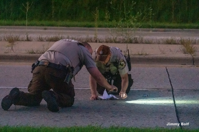 Cook County Sheriff's police officers working on investigation at a fatal motorcycle crash with a vehicle on eastbound Lake Cook Road just west of the Route 53 spur (PHOTO CREDIT: Jimmy Bolf)