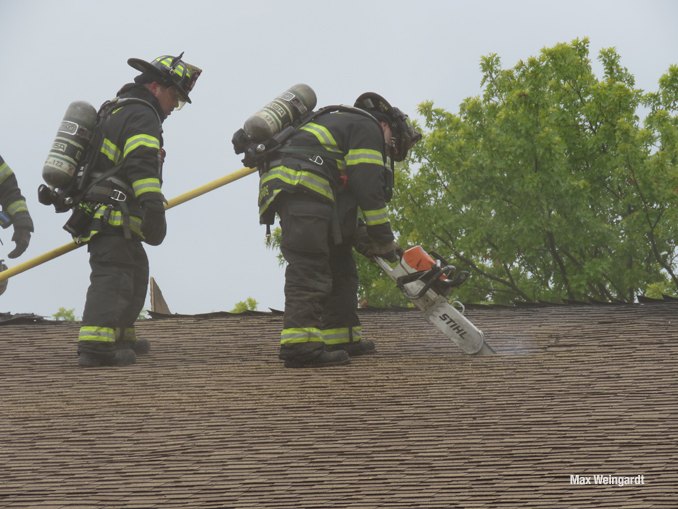 Firefighters cutting open the roof (PHOTO CREDIT: Max Weingardt)