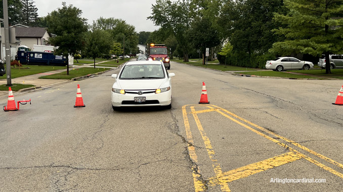A female driver ignored traffic cones where Hintz Road was blocked and the rolled over pickup truck was obstructing lane just beyond the traffic cones.