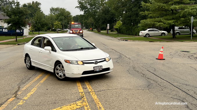 A female driver ignored traffic cones where Hintz Road was blocked and the rolled over pickup truck was obstructing lane just beyond the traffic cones.