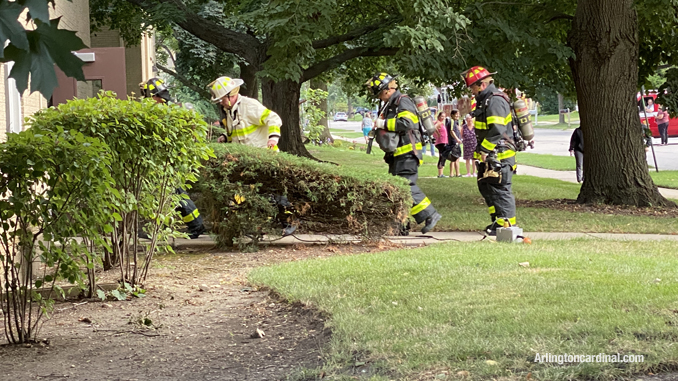 Firefighters entering the building on the west side at Cleveland Avenue in Arlington Heights.