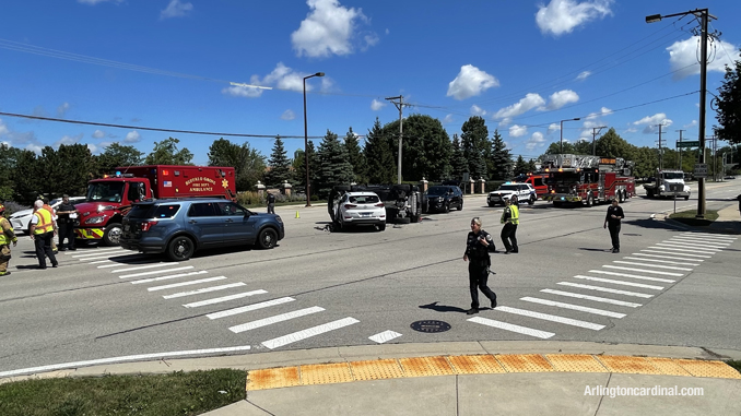 Safe scene and traffic control managed by Buffalo Grove police and firefighters at a rollover crash on Buffalo Grove just north of Lake Cook Road