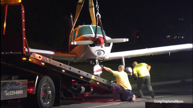Towing the aircraft off of Milwaukee Avenue (Craig/CapturedNews)