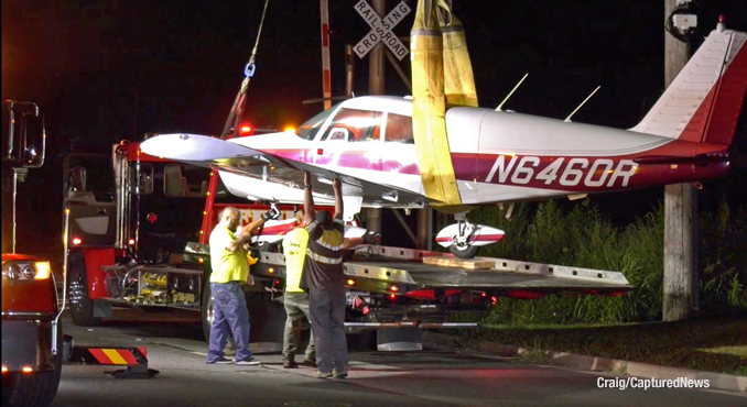 Towing the aircraft off of Milwaukee Avenue (Craig/CapturedNews)