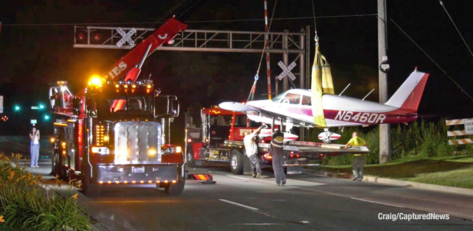 Towing the aircraft off of Milwaukee Avenue (Craig/CapturedNews)