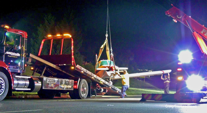 Towing the aircraft off of Milwaukee Avenue (Craig/CapturedNews)